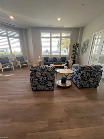Living room featuring plenty of natural light and hardwood / wood-style flooring