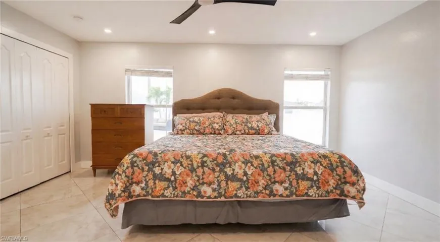 Bedroom featuring a closet, a ceiling fan, and recessed lighting