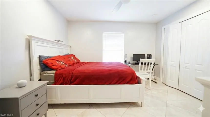 Bedroom featuring a closet and ceiling fan