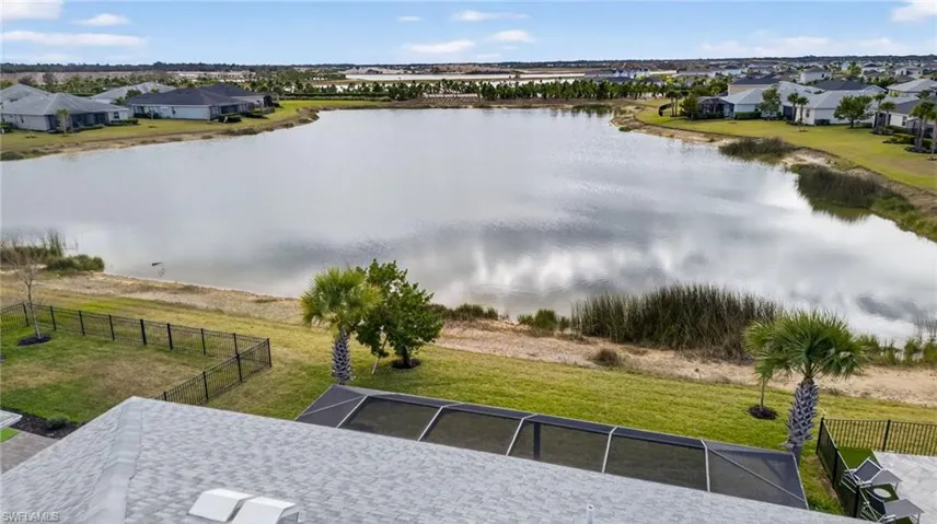 Aerial view of residential area featuring a large body of water