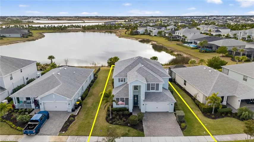 Aerial perspective of suburban area featuring property parcel outlined