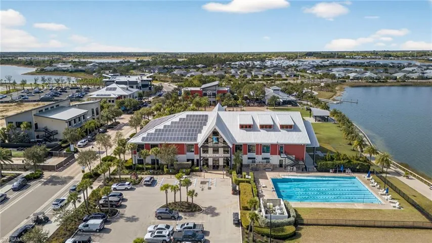 Aerial view of a nearby body of water and a pool