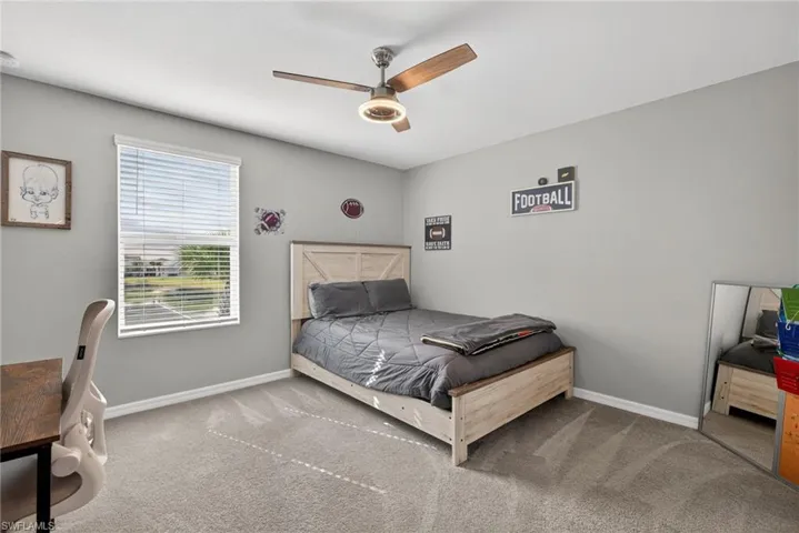 Bedroom featuring carpet and ceiling fan
