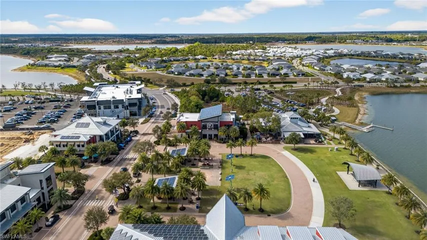 Aerial view of residential area featuring a large body of water