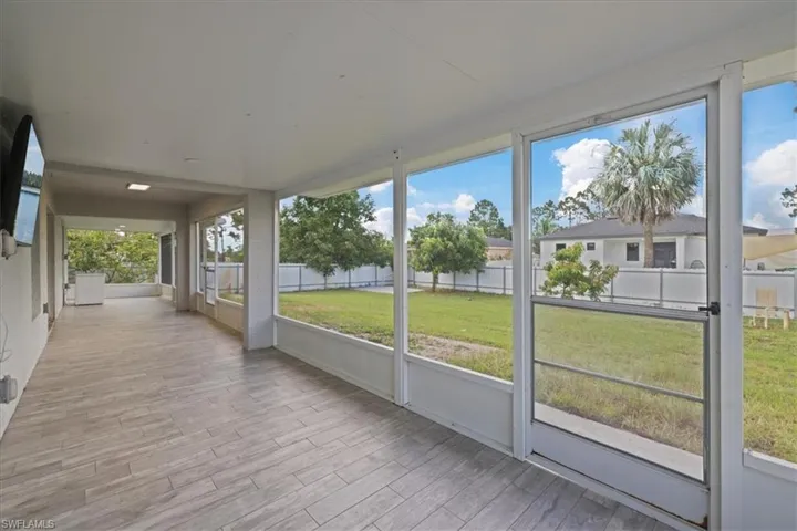 Unfurnished sunroom with healthy amount of natural light