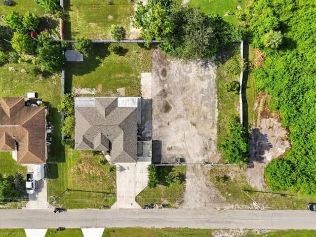 Ranch-style house with an attached garage, stucco siding, concrete driveway, and roof with shingles