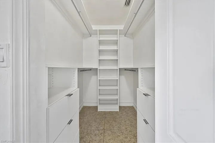 Walk in closet featuring light tile patterned floors
