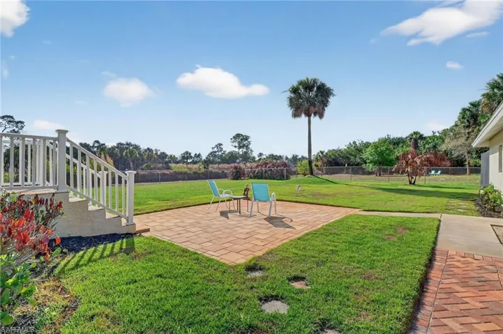 Fenced yard featuring a patio