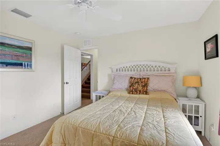 Bedroom featuring carpet and ceiling fan