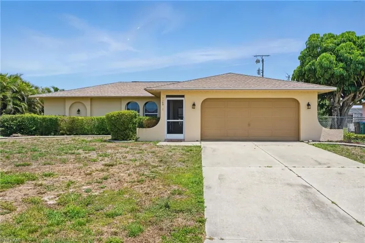 Front of home with a 2 car garage