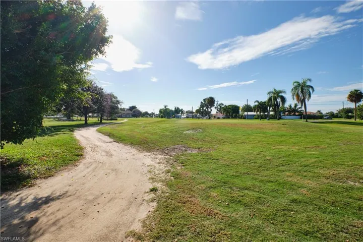 View of home's community featuring a yard