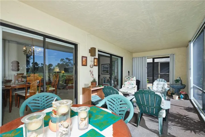 Sunroom / solarium featuring carpet floors