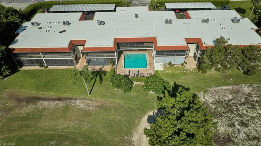 Aerial view of property's location featuring a pool area
