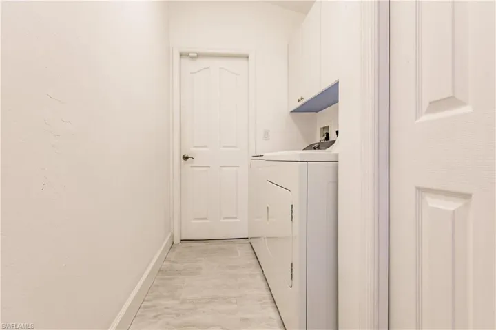 Clothes washing area with cabinets and hookup for a washing machine