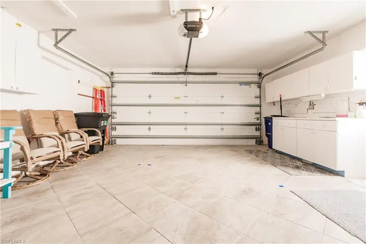 Garage featuring a garage door opener