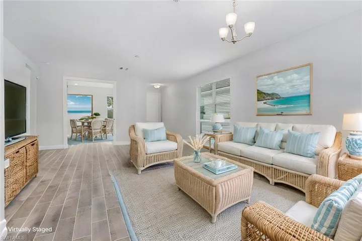 VIRTUALLY STAGED LIVINGROOM WITH A VIEW OF THE FLEX ROOM