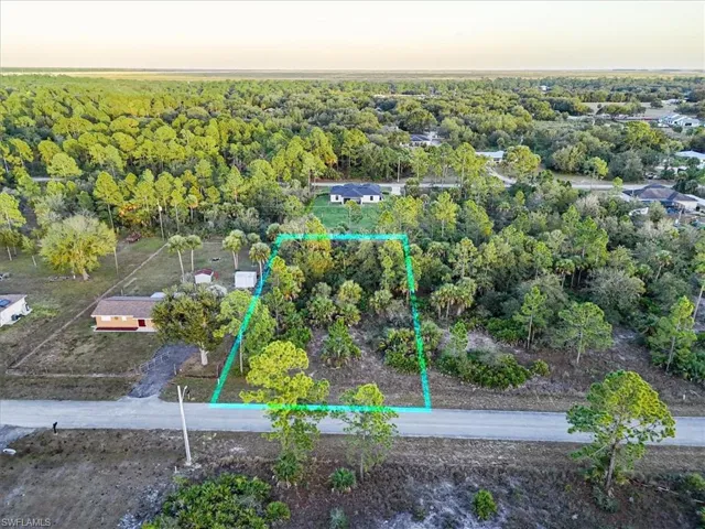 Aerial view at dusk of property boundaries highlighted