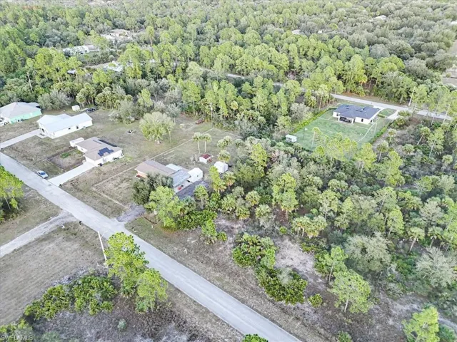 View of property location with a forest