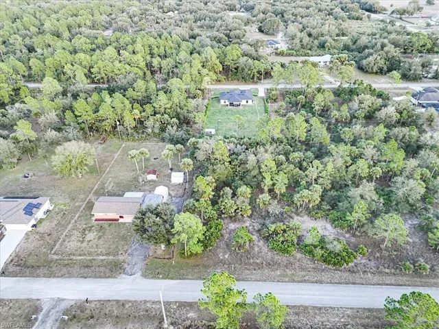 Aerial overview of property's location featuring a forest