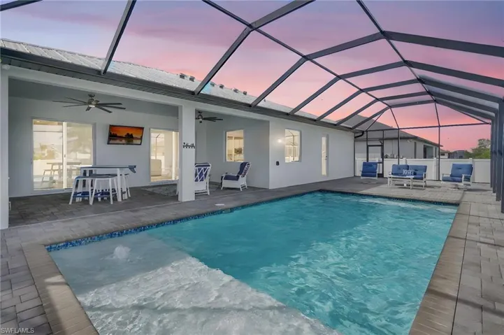 View of pool featuring a fenced in pool, a patio area, and ceiling fan