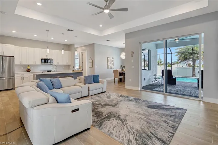 Modern open floor plan with ceramic plank flooring.