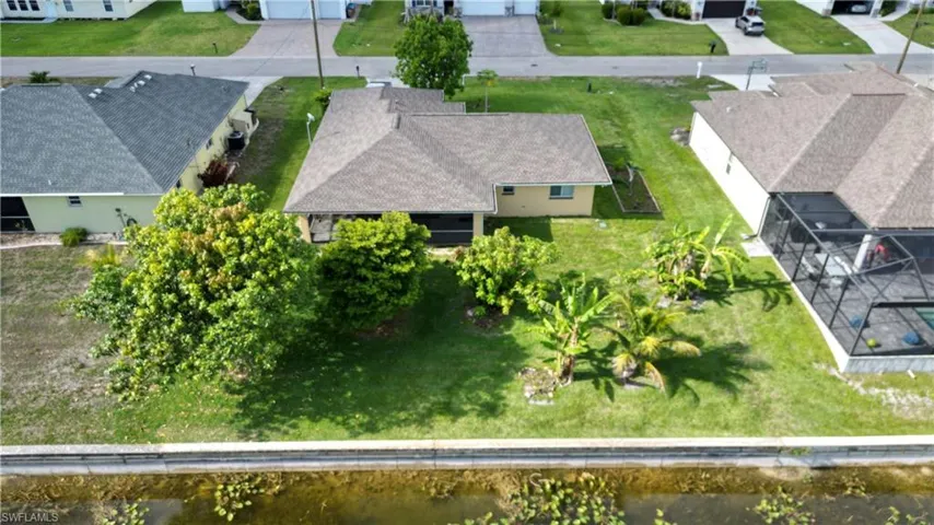 View from above of property with a nearby body of water