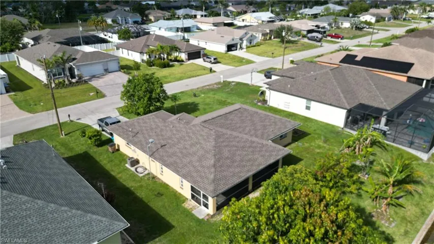 Ranch-style home with stucco siding and a front lawn