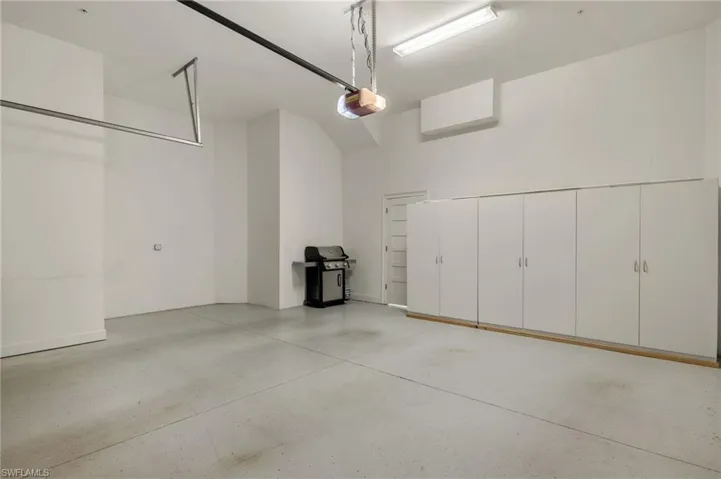 Garage featuring a garage door opener