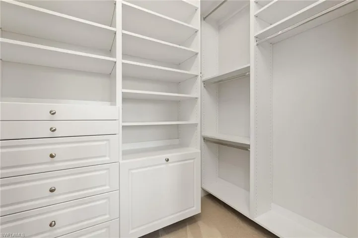 Walk in closet featuring carpet flooring