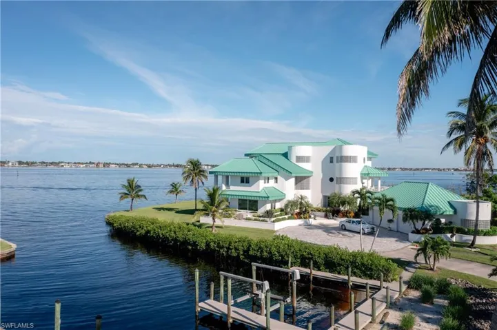 Water view with boat lift and a dock