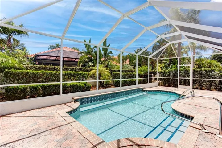 View of pool with a patio and a lanai