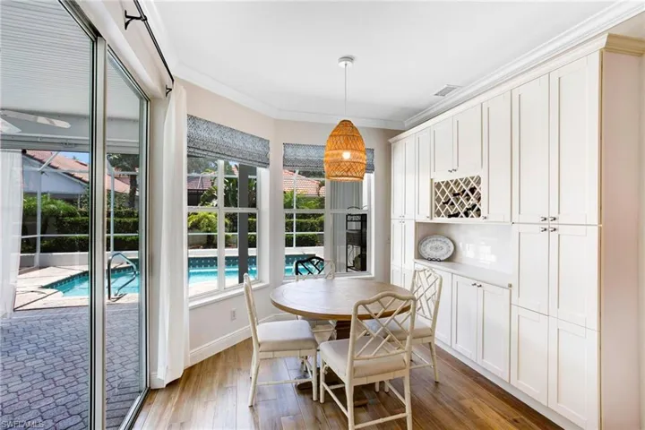 Dining room featuring crown molding and hardwood / wood-style floors