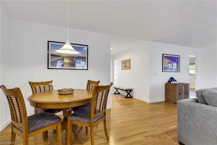 Dining room with light wood-style floors and baseboards