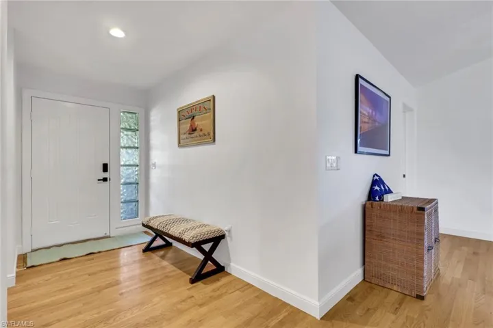 Foyer featuring light wood-type flooring and recessed lighting