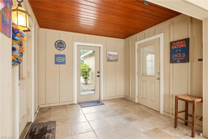 Breezeway/ entrance to garage, patio and home, with tongue and groove ceiling