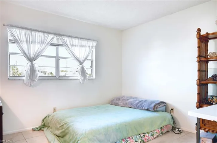 Bedroom featuring light tile patterned floors
