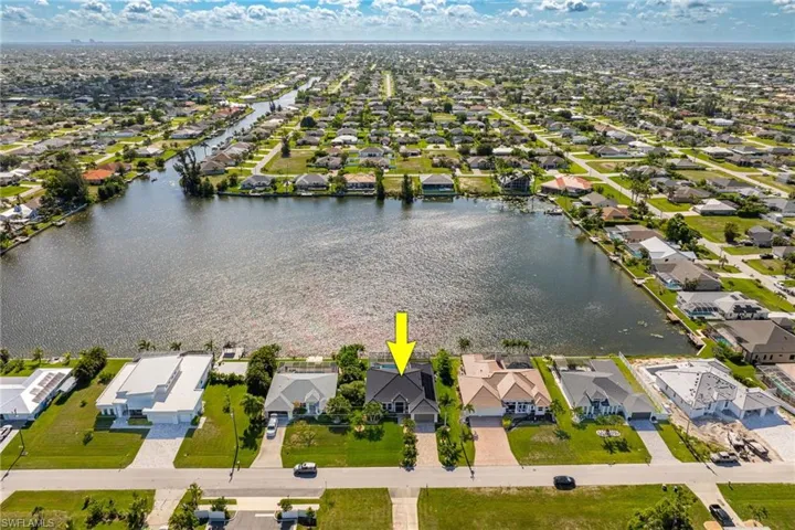 Aerial view of residential area featuring view of Lake Memory