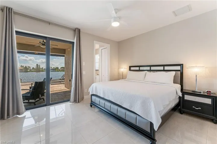 Bedroom featuring access to outside pool area plus bathroom that has access to pool areea.