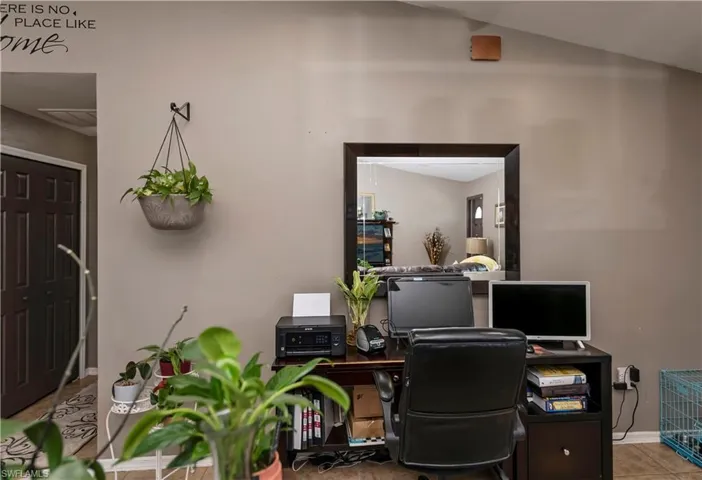 Tiled office with lofted ceiling