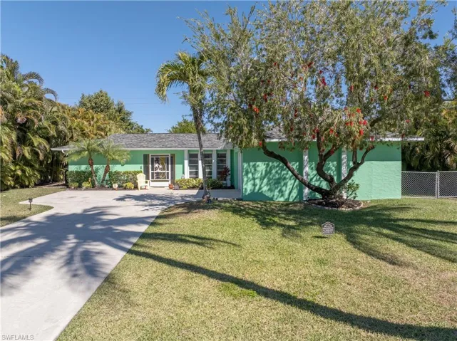 View of Front Street Elevation from Front Right [Note Left/Right Property Privacy-Lined Areca Palms]