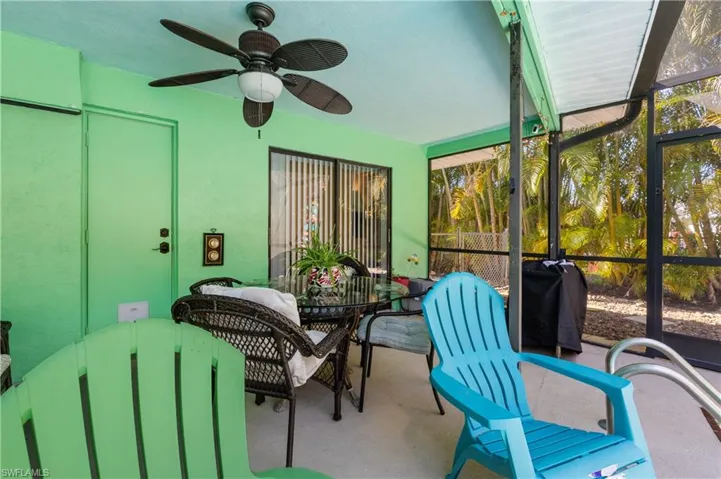 View of the Lanai Dining/Pool Deck with Slider to the West Ensuite [Note Newly Painted Whole House Exterior