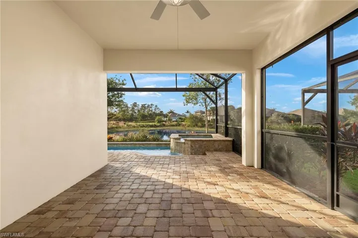 Covered lanai overlooking pool, spa & lake views