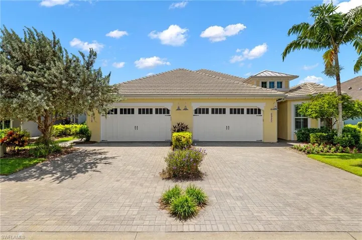 View of front of property with a garage
