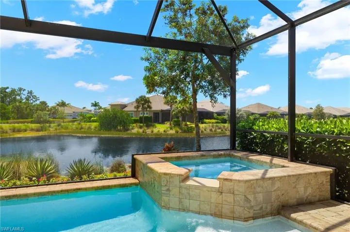 Pool with raised spa &tranquil water views.