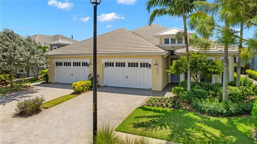 View of front facade with a garage and a front yard
