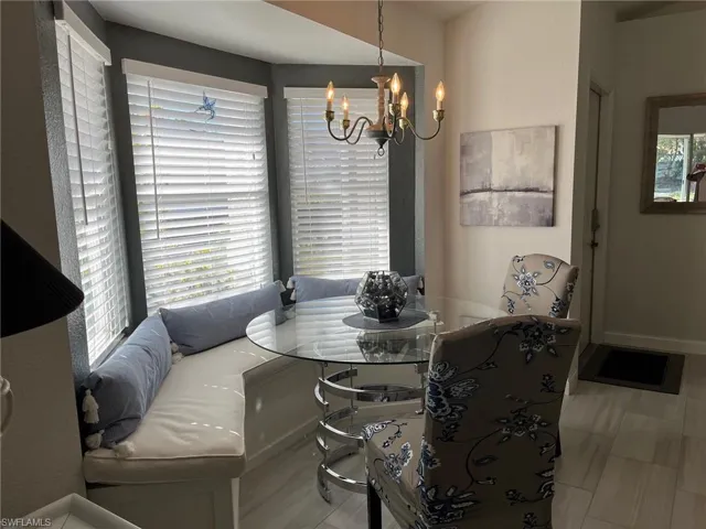 Dining area with breakfast area and a chandelier