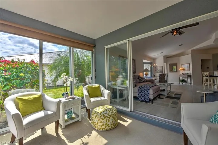 Sunroom / solarium with ceiling fan and lofted ceiling