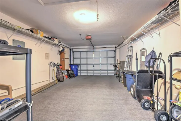 Garage featuring a garage door opener