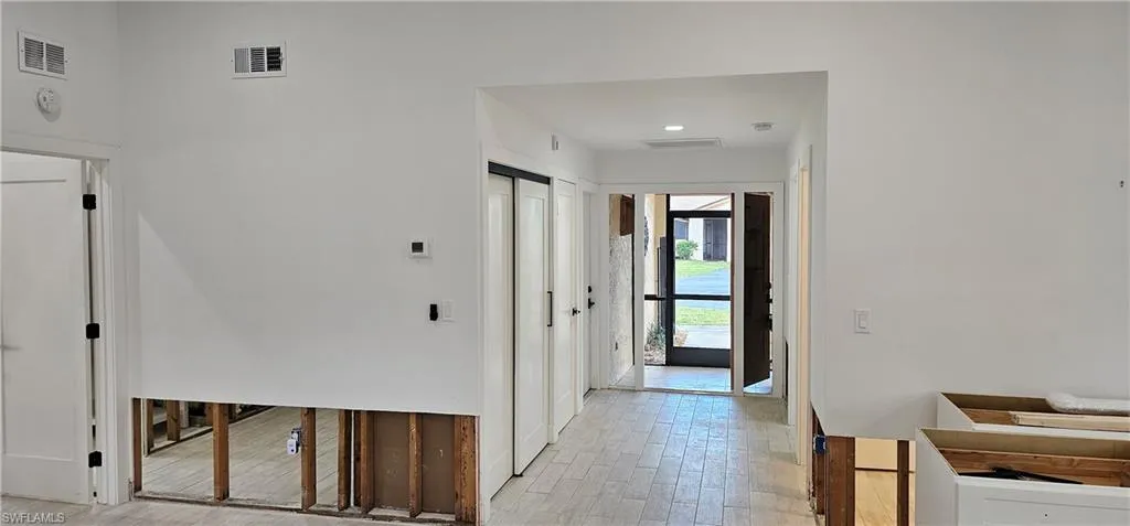 Hallway with light wood-type flooring