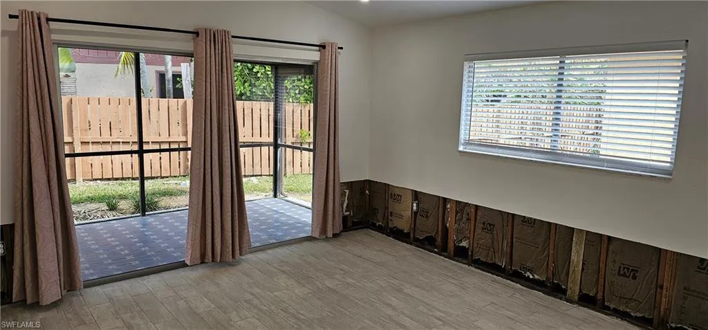 Doorway with light hardwood / wood-style floors